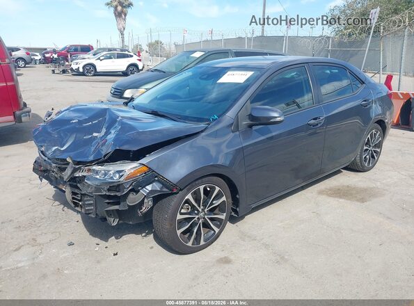 5YFBURHE9JP769931 2018 TOYOTA COROLLA Серый Передняя левая четверть
