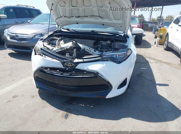 5YFBURHEXKP875032 2019 TOYOTA COROLLA White Vista frontal