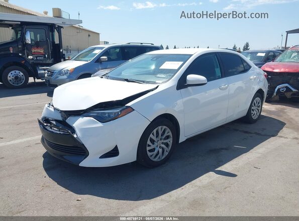 5YFBURHEXKP875032 2019 TOYOTA COROLLA White Vista tres cuartos delantera izquierda