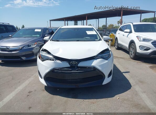 5YFBURHEXKP875032 2019 TOYOTA COROLLA White Vista del cuadro de instrumentos
