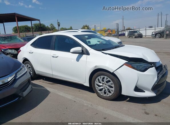 5YFBURHEXKP875032 2019 TOYOTA COROLLA White Vista interior trasera