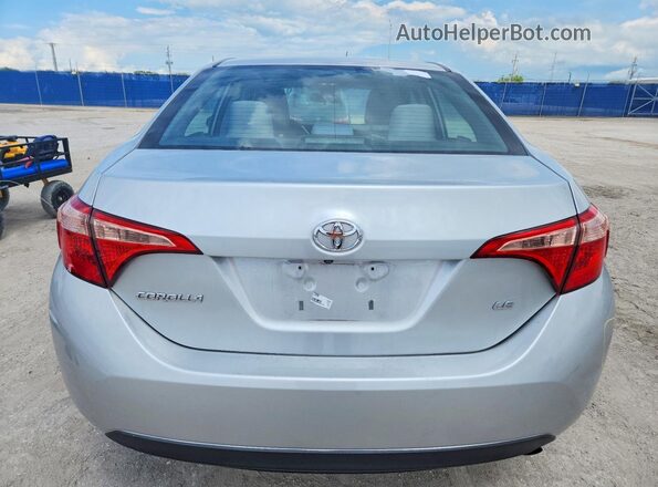 5YFBURHEXKP934175 2019 TOYOTA COROLLA Silver უკანა ხედი