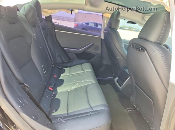 5YJ3E1EA0RF862557 2024 TESLA MODEL Black Հետևի նստատեղերի տեսք