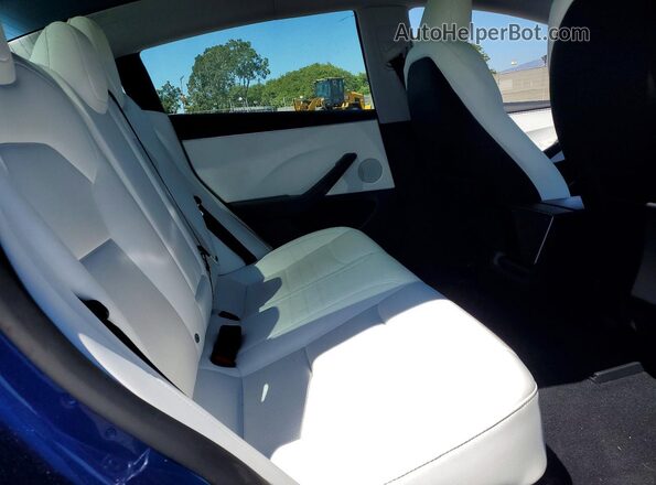 5YJ3E1EA5SF003504 2025 TESLA MODEL Blue Widok tylnych siedzeń