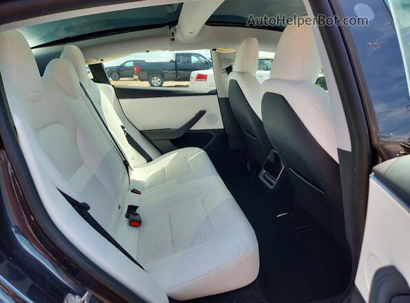 5YJ3E1EB2RF810050 2024 TESLA MODEL Gray Rear seats view