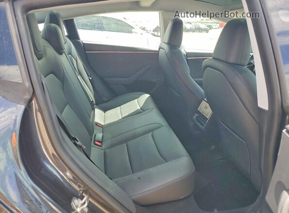 5YJ3E1EB6RF736518 2024 TESLA MODEL Charcoal Vista de los asientos traseros