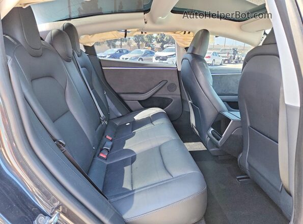 5YJ3E1EB8RF732633 2024 TESLA MODEL Charcoal Rear seats view