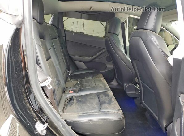 5YJYGDEE4MF210974 2021 TESLA MODEL Black Vista de los asientos traseros