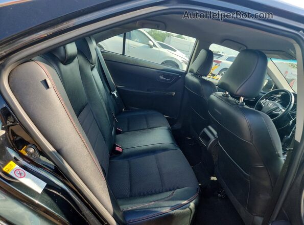 4T1BF1FK7HU713810 2017 TOYOTA CAMRY Black Widok wnętrza z tyłu