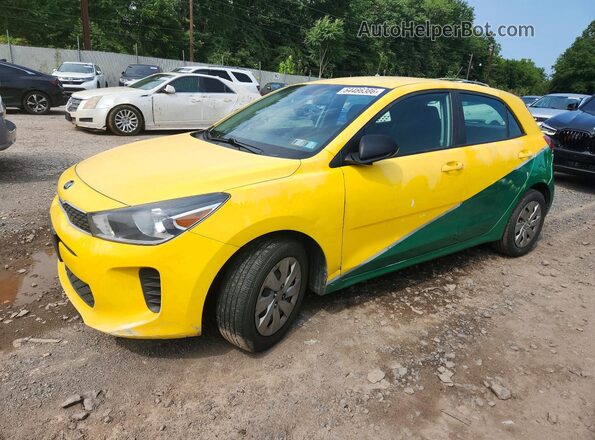 3KPA25AB8JE119984 2018 KIA RIO Yellow Trasero izquierdo