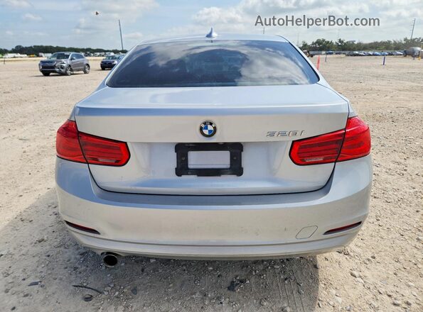 WBA8A9C5XJAH14547 2018 BMW 3 SERIES Silver Front interior view