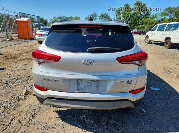 KM8J3CA23JU615371 2018 HYUNDAI TUCSON Silver Vista interior delantera