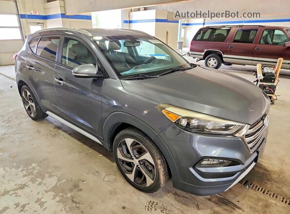KM8J33A2XHU389033 2017 HYUNDAI TUCSON Gray Вид спереду
