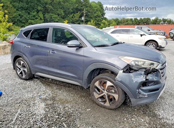 KM8J33A23HU352289 2017 HYUNDAI TUCSON Gray Front view