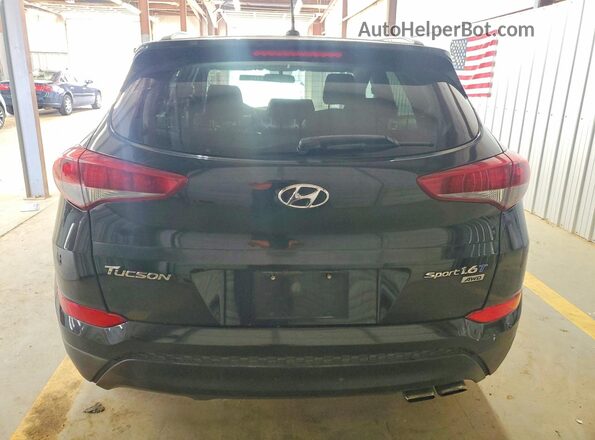 KM8J3CA24GU069334 2016 HYUNDAI TUCSON Black Вид салону спереду