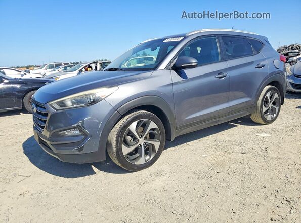 KM8J33A29GU112842 2016 HYUNDAI TUCSON Gray Trasero izquierdo