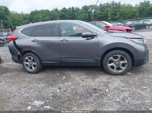 7FARW2H57JE016351 2018 HONDA CR-V Gray Widok wnętrza z tyłu