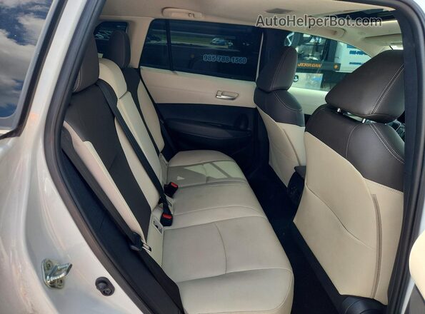 7MUDAAAGXPV071154 2023 TOYOTA COROLLA White Rear interior view