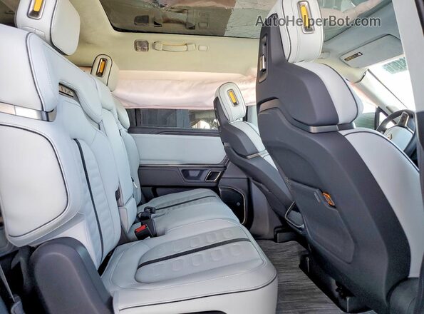 7PDSGABA1PN030162 2023 RIVIAN R1S Green Rear interior view