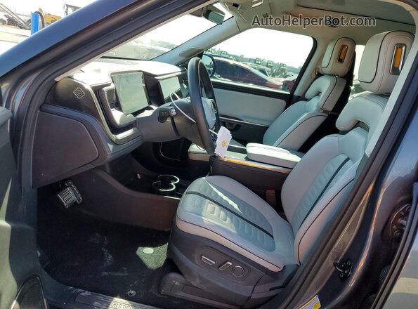 7PDSGABA9PN010077 2023 RIVIAN R1S Gray Front interior view