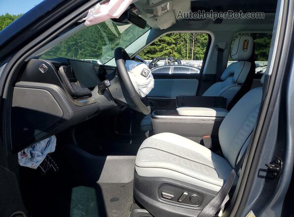 7PDSGABL3PN020878 2023 RIVIAN R1S Gray Front interior view