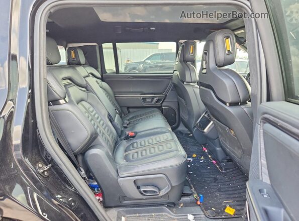 7PDSGCBA9RN045068 2024 RIVIAN R1S Black Rear interior view