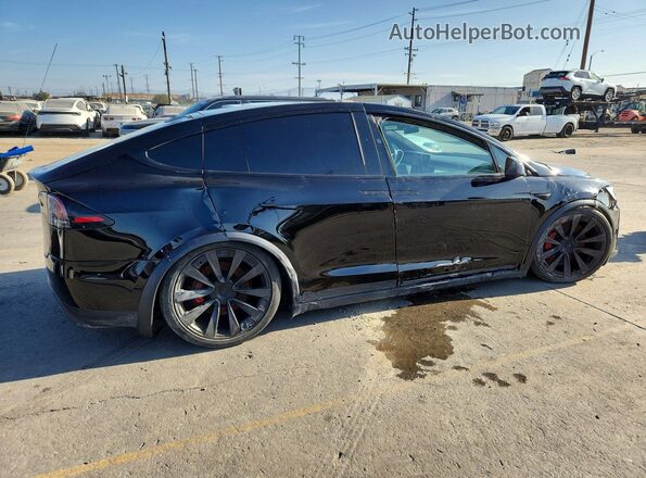 7SAXCBE61PF404194 2023 TESLA MODEL X Черный Передняя правая четверть