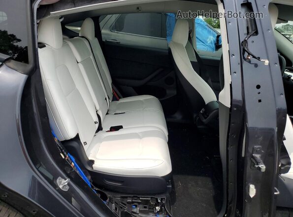7SAYGAEE1SF244367 2025 TESLA MODEL Black Սալոնի հետևի տեսք