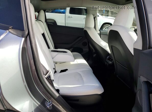 7SAYGAEE4RF209879 2024 TESLA MODEL Silver Rear seats view