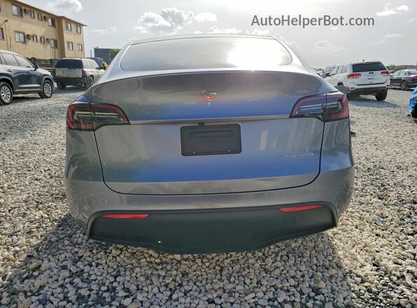 7SAYGAEE4RF209879 2024 TESLA MODEL Silver Rear view