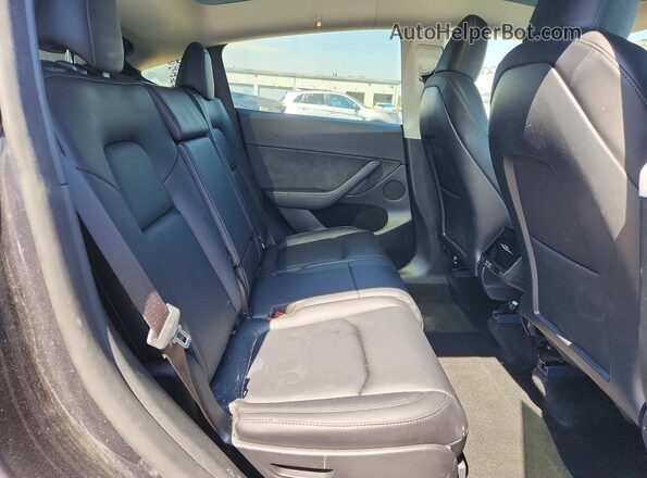 7SAYGAEE8RF080979 2024 TESLA MODEL Black Rear interior view