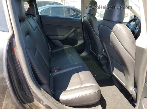 7SAYGDED1RF097907 2024 TESLA MODEL Gray Вид задніх сидінь