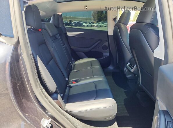 7SAYGDED1SF321151 2025 TESLA MODEL Gray Rear interior view