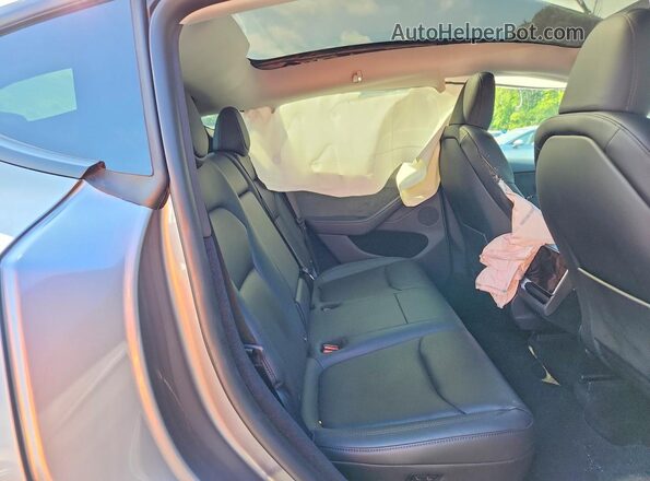 7SAYGDED1TF434132 2026 TESLA MODEL Gray Rear seats view