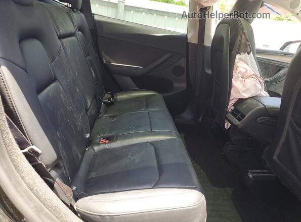 7SAYGDED4RF202522 2024 TESLA MODEL Black Widok wnętrza z tyłu