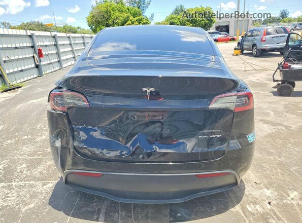 7SAYGDED4RF202522 2024 TESLA MODEL Black Widok z tyłu