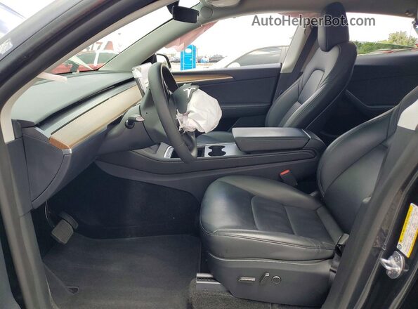 7SAYGDED5SF231825 2025 TESLA MODEL Gray Front interior view