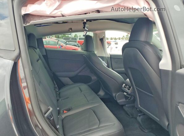 7SAYGDED5SF231825 2025 TESLA MODEL Gray Rear seats view