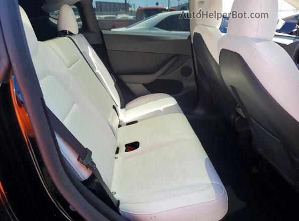 7SAYGDED7RF103161 2024 TESLA MODEL Black Հետևի նստատեղերի տեսք