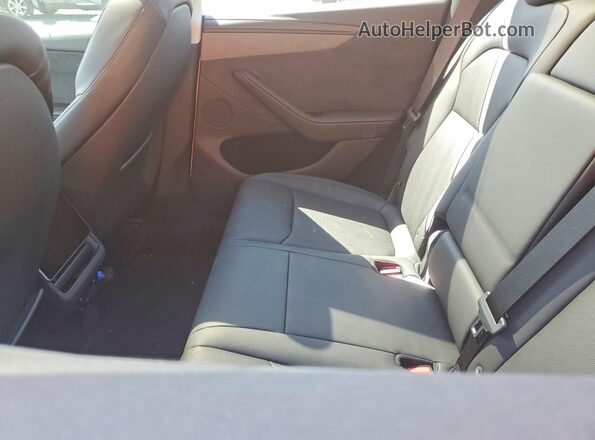 7SAYGDED7TA454852 2026 TESLA MODEL White Vista de los asientos traseros