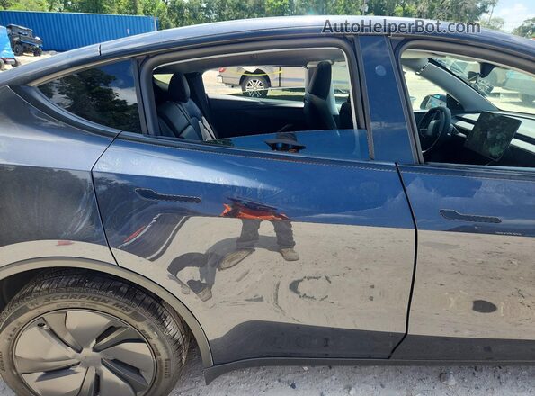 7SAYGDED7TA620268 2026 TESLA MODEL Gray Vista de los asientos traseros