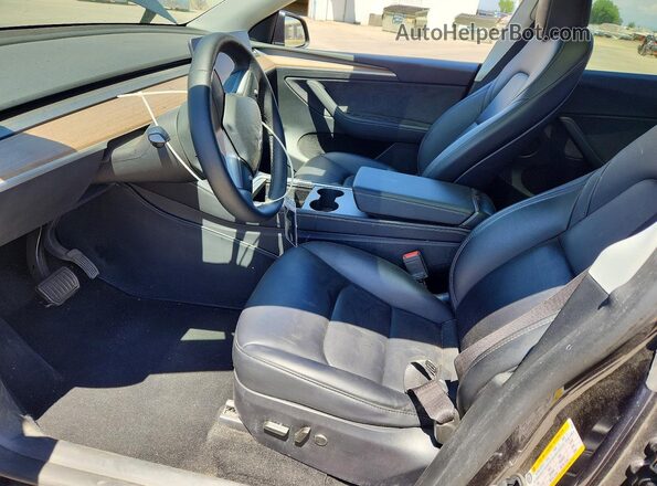 7SAYGDED9RF111519 2024 TESLA MODEL Charcoal Front interior view