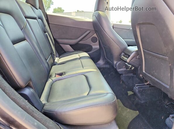 7SAYGDED9RF111519 2024 TESLA MODEL Charcoal Rear seats view