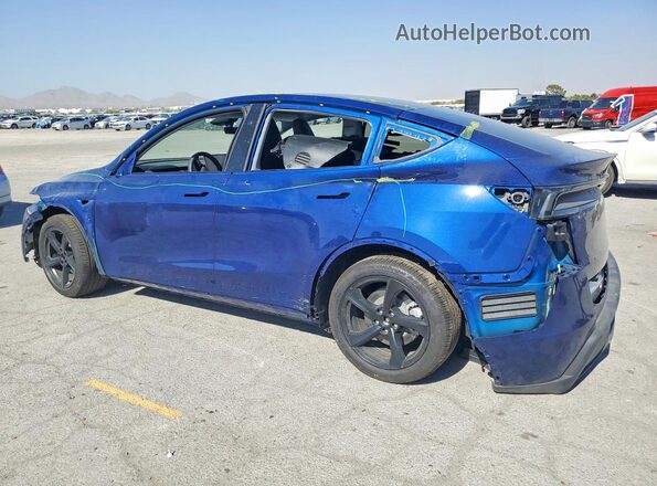 7SAYGDED9TA579884 2026 TESLA MODEL Blue Trasero izquierdo