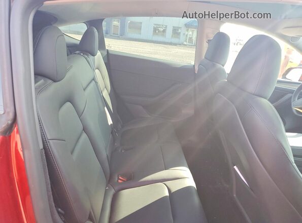 7SAYGDEE0RF019997 2024 TESLA MODEL Red Vista de los asientos traseros