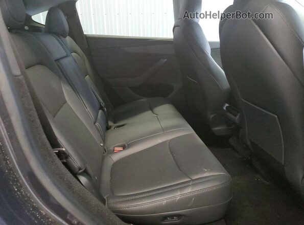 7SAYGDEE0TA431230 2026 TESLA MODEL Charcoal Սալոնի հետևի տեսք