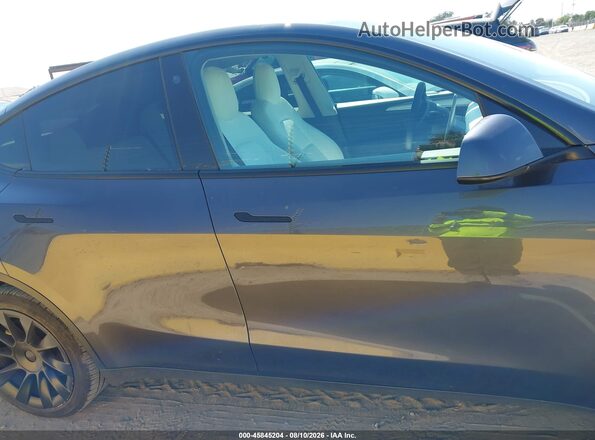 7SAYGDEE1PF608277 2023 TESLA MODEL Y Gray Սալոնի հետևի տեսք
