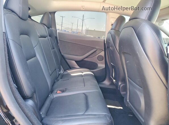 7SAYGDEE1RF133457 2024 TESLA MODEL Black Vista de los asientos traseros