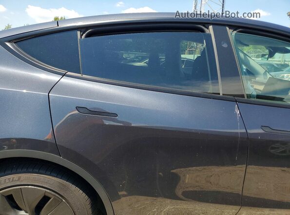 7SAYGDEE2RF130180 2024 TESLA MODEL Charcoal Rear interior view