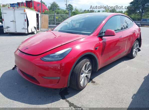 7SAYGDEE3PF703942 2023 TESLA MODEL Y Red Առջևի ձախ երեք քառորդ տեսարան